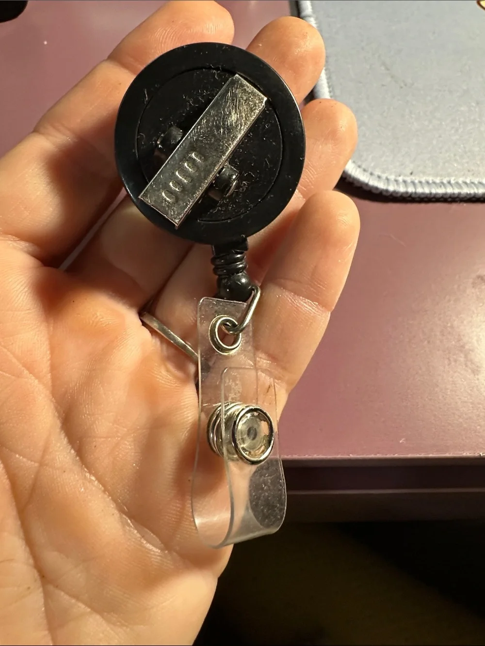 “It’s fine, I’m fine, Everything’s fine” badge reel; dumpster fire. ER